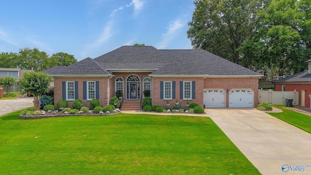 1405 Cedarhurst Ct, Decatur, AL 35603 - view of front of property featuring brick siding, concrete driveway, a shingled roof, and a garage