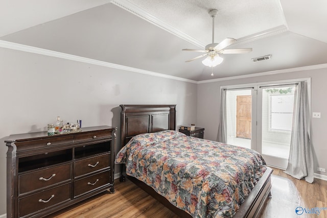 bedroom with light hardwood / wood-style flooring, ceiling fan, and crown molding
