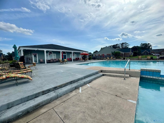 view of swimming pool with a patio area