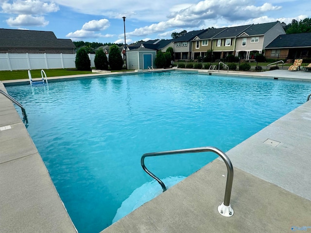 view of pool featuring an outdoor structure