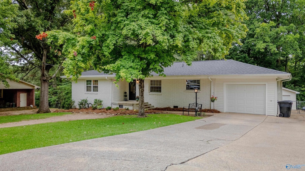 single story home featuring a garage