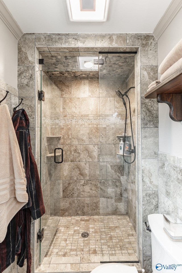 full bath with crown molding, tile walls, and a shower stall