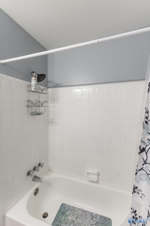 full bathroom featuring shower / tub combo with curtain