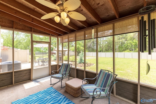 sunroom / solarium featuring ceiling fan and a healthy amount of sunlight