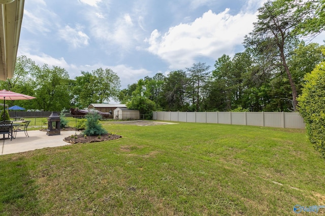 view of yard featuring a patio and fence