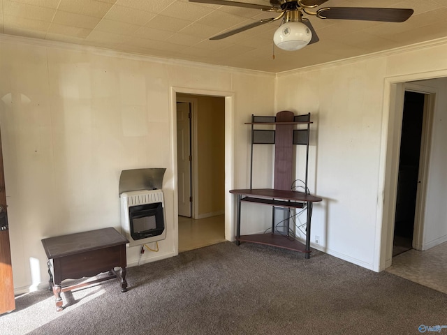 unfurnished living room featuring heating unit, carpet flooring, and ornamental molding