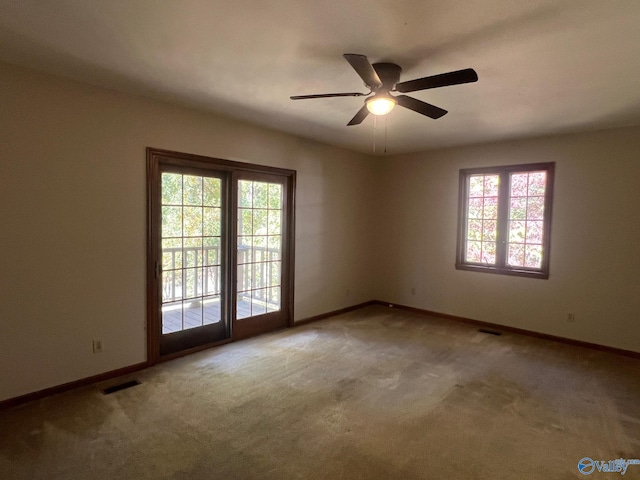 carpeted empty room with ceiling fan