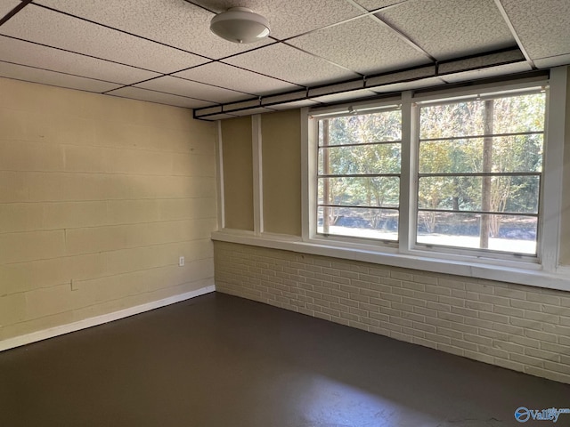 empty room with a paneled ceiling