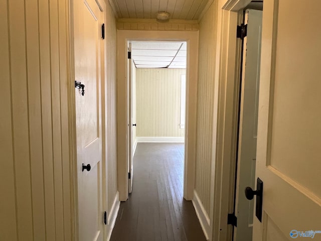 hallway with dark hardwood / wood-style flooring