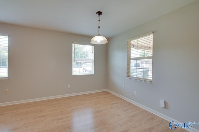 2404 Yorkshire Cir SW, Huntsville, AL 35803 - spare room featuring light wood-type flooring and baseboards