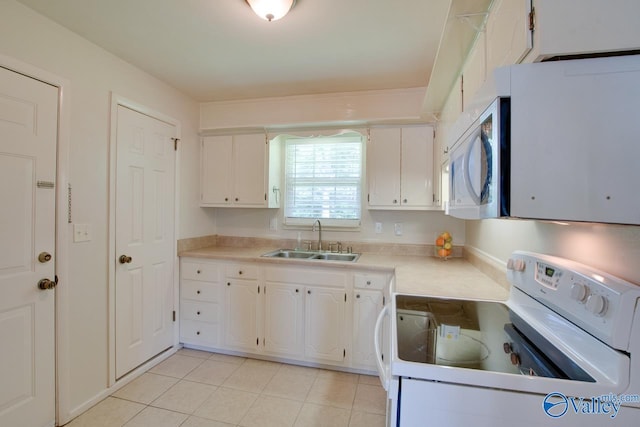 2404 Yorkshire Cir SW, Huntsville, AL 35803 - kitchen with white appliances, a sink, white cabinetry, and light tile patterned floors