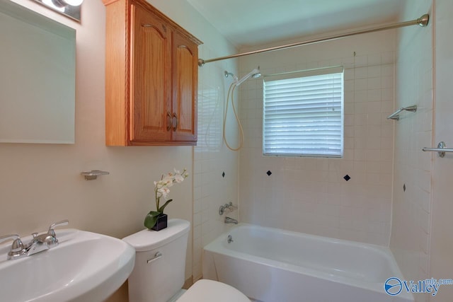 2404 Yorkshire Cir SW, Huntsville, AL 35803 - bathroom featuring a sink, toilet, and washtub / shower combination