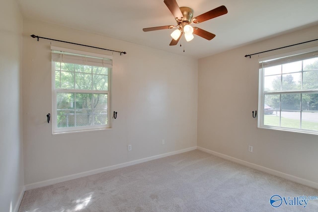 2404 Yorkshire Cir SW, Huntsville, AL 35803 - spare room featuring carpet, baseboards, and a ceiling fan