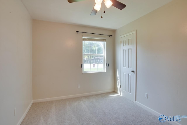 2404 Yorkshire Cir SW, Huntsville, AL 35803 - spare room with a ceiling fan, carpet flooring, and baseboards