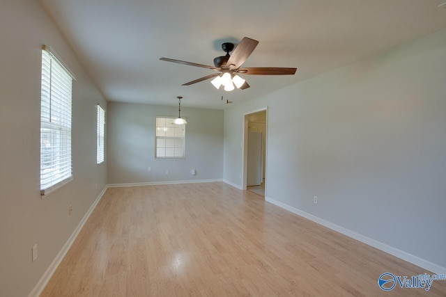 2404 Yorkshire Cir SW, Huntsville, AL 35803 - unfurnished room with light wood-type flooring, a ceiling fan, and baseboards