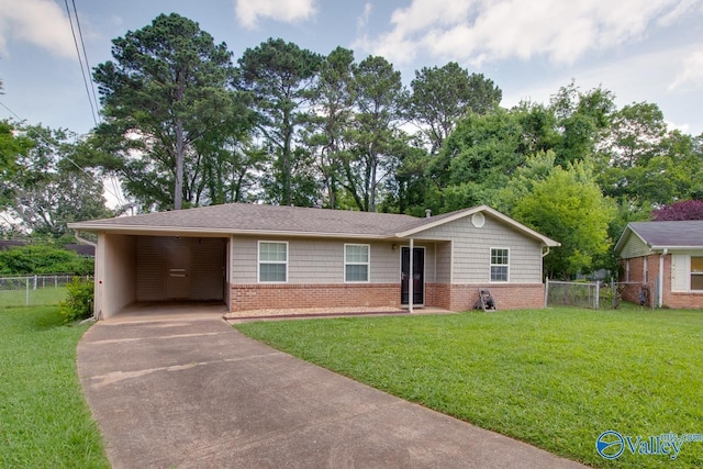 2404 Yorkshire Cir SW, Huntsville, AL 35803 - single story home with driveway, brick siding, and an attached carport