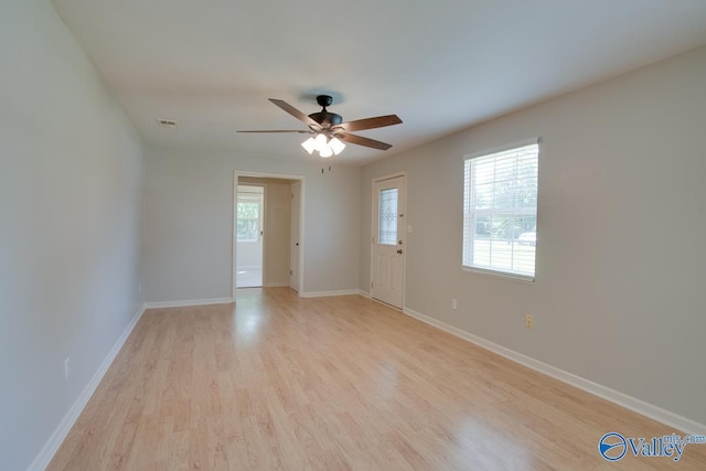 2404 Yorkshire Cir SW, Huntsville, AL 35803 - empty room with light wood-type flooring, a ceiling fan, and baseboards