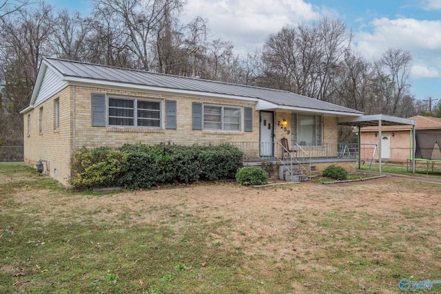 ranch-style house with a trampoline, covered porch, and a front yard