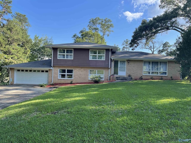 split level home featuring a front yard and a garage