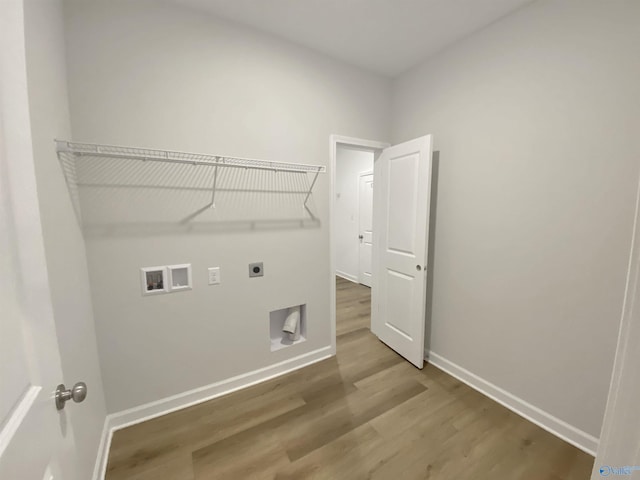 laundry room with hardwood / wood-style flooring, washer hookup, and hookup for an electric dryer