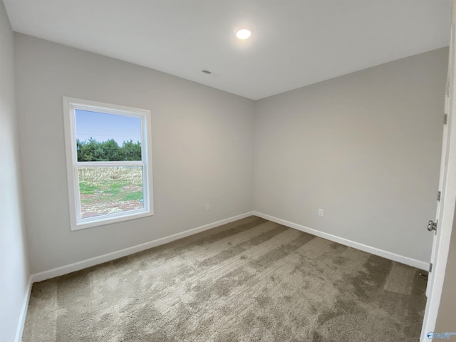 empty room featuring carpet flooring