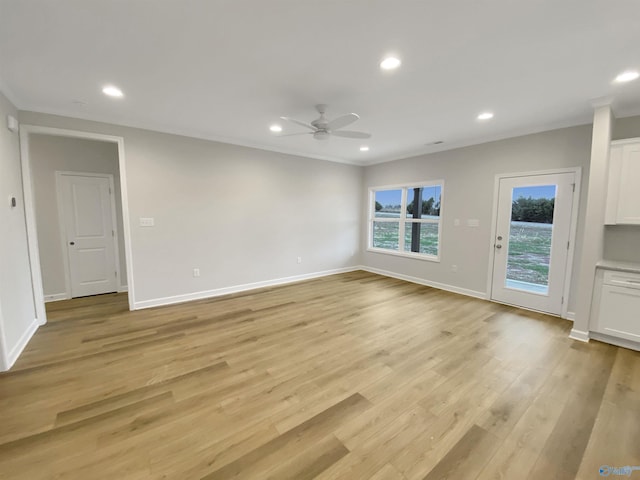 unfurnished living room featuring light hardwood / wood-style flooring and ceiling fan