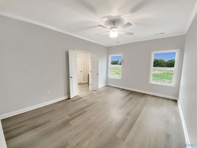 unfurnished bedroom with ceiling fan and light hardwood / wood-style floors