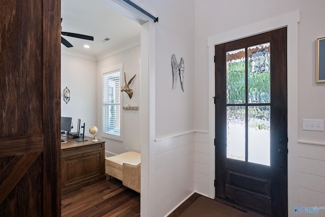 entryway with crown molding, ceiling fan, and dark hardwood / wood-style floors