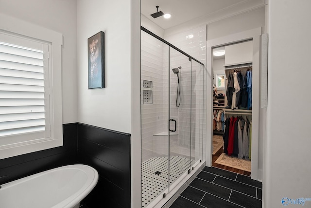 bathroom featuring tile patterned flooring and independent shower and bath