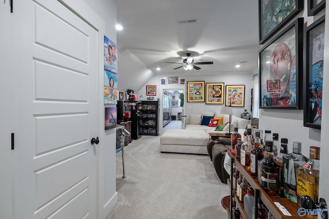 carpeted living room featuring lofted ceiling and ceiling fan