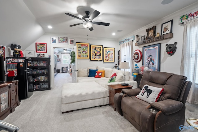 living room featuring light carpet, crown molding, lofted ceiling, and ceiling fan