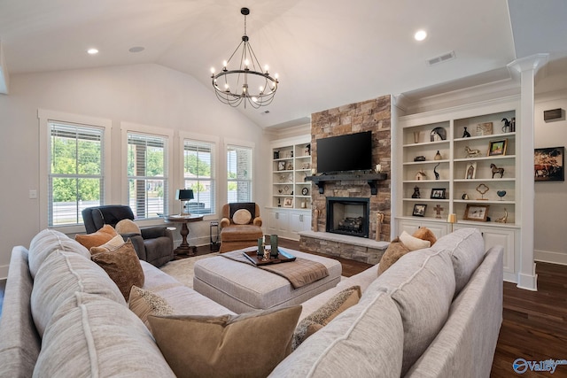 living room featuring dark hardwood / wood-style flooring, a stone fireplace, plenty of natural light, and built in features