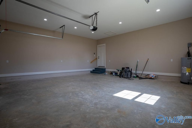 garage featuring recessed lighting, a garage door opener, baseboards, and electric water heater