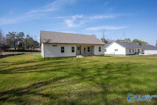 rear view of property featuring crawl space and a yard