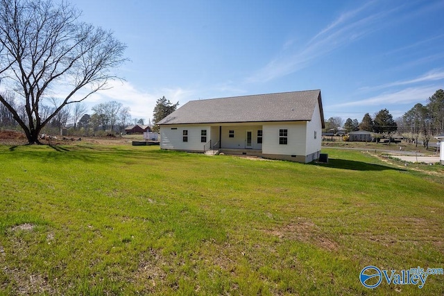 view of front facade with crawl space, a front yard, and roof with shingles