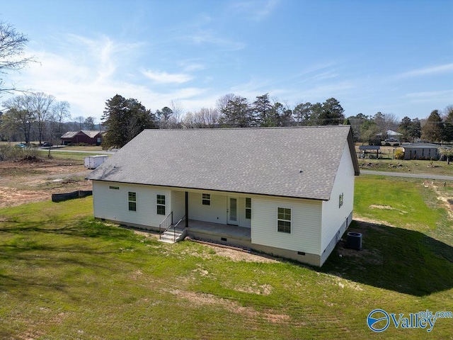 rear view of house featuring crawl space, a yard, a patio, and roof with shingles