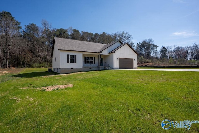 view of front facade with crawl space, driveway, a front lawn, and a garage
