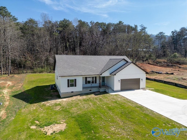 view of front of property featuring crawl space, an attached garage, driveway, and a front lawn