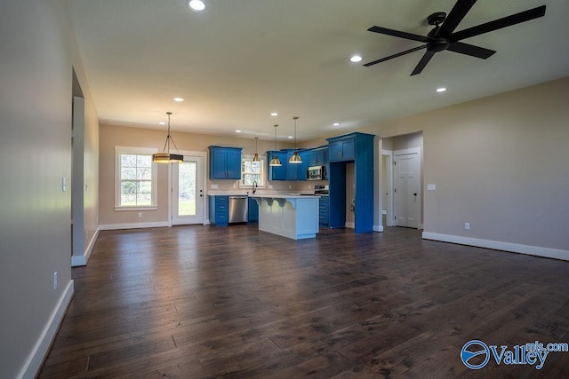 interior space with dark wood finished floors, recessed lighting, baseboards, and ceiling fan