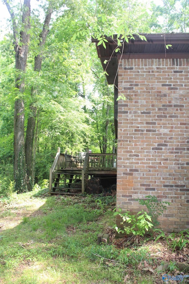 view of yard featuring a wooden deck