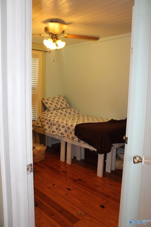 bedroom with wood-type flooring and ceiling fan
