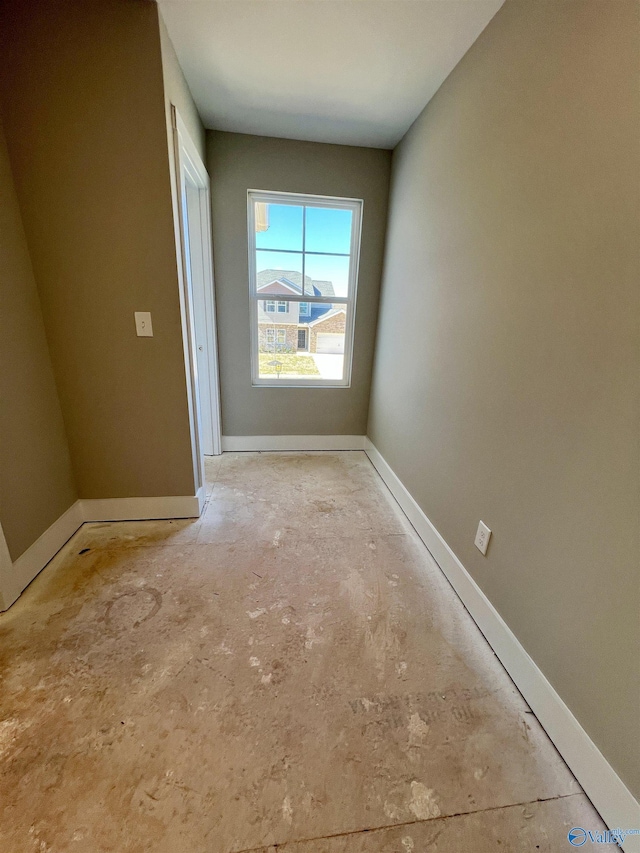 interior space featuring baseboards