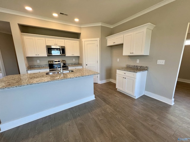 kitchen featuring dark wood-style flooring, stainless steel appliances, visible vents, ornamental molding, and light stone countertops