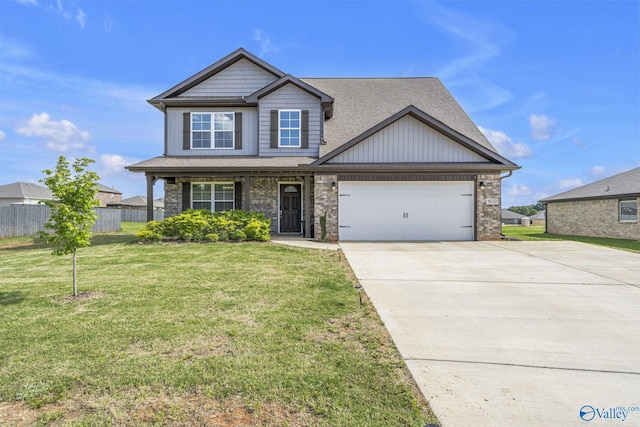 craftsman-style home featuring a garage and a front lawn