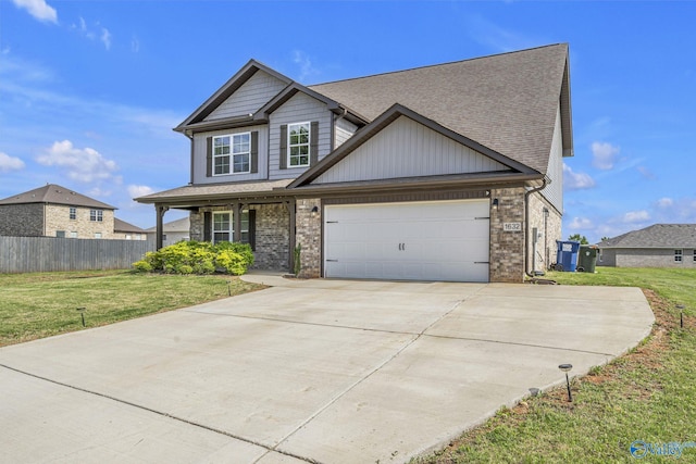 craftsman-style home with a garage and a front yard