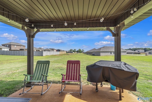 view of patio featuring a grill