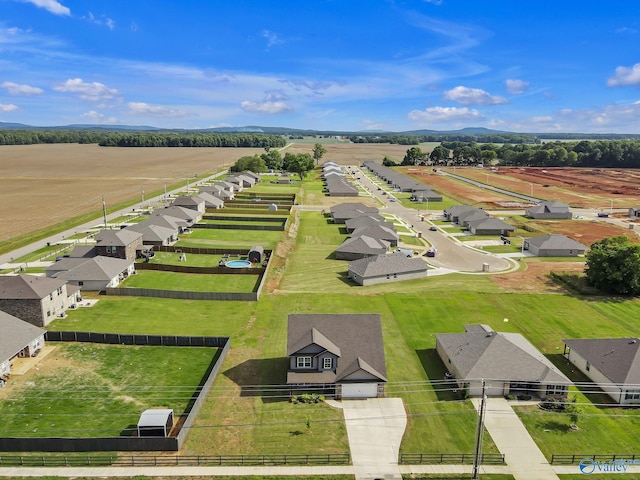 birds eye view of property with a rural view