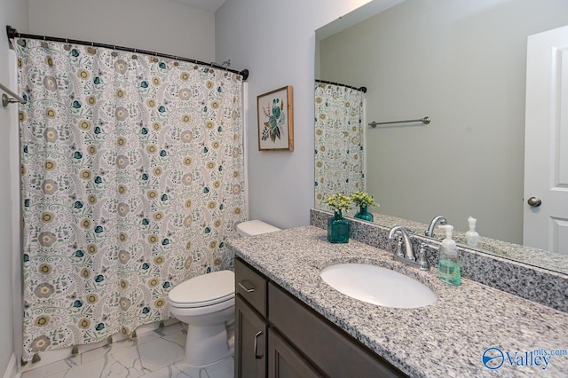 bathroom featuring vanity, toilet, and tile patterned flooring