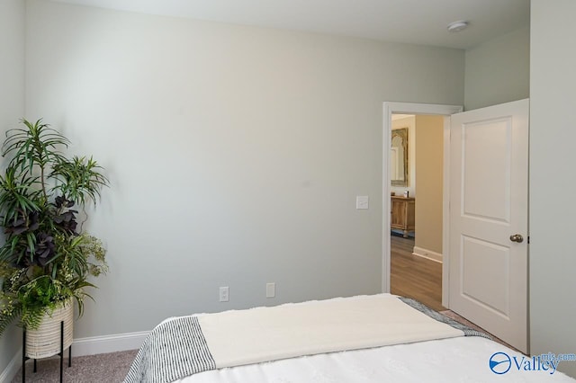 bedroom with wood-type flooring