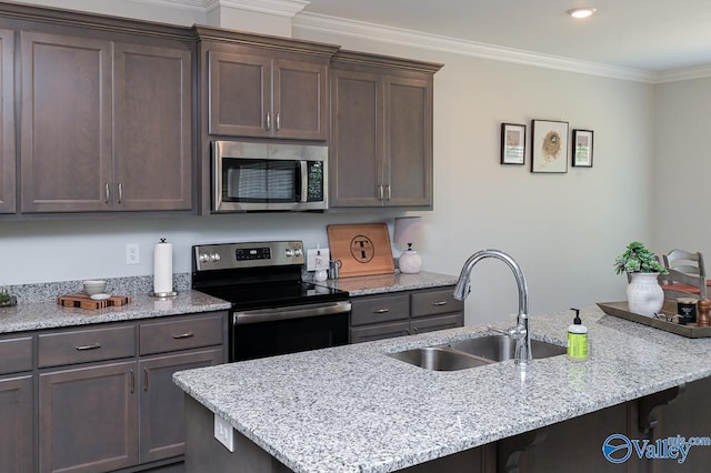 kitchen featuring stainless steel appliances, sink, light stone counters, dark brown cabinets, and crown molding